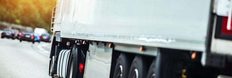 Semi Truck on the Route To Delivery Destination. Speeding Truck on a Highway.